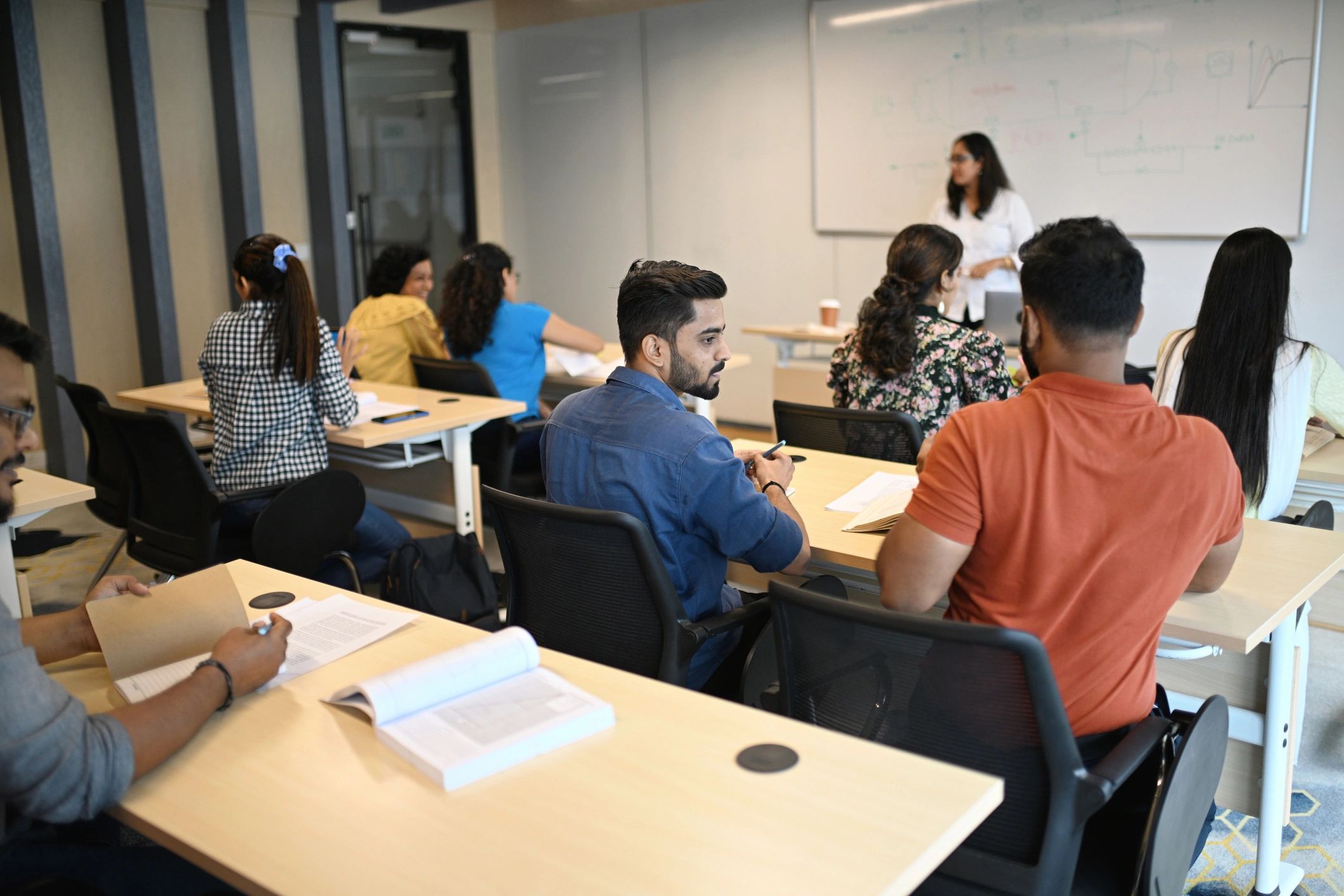 Instructor teaching adult students in a classroom