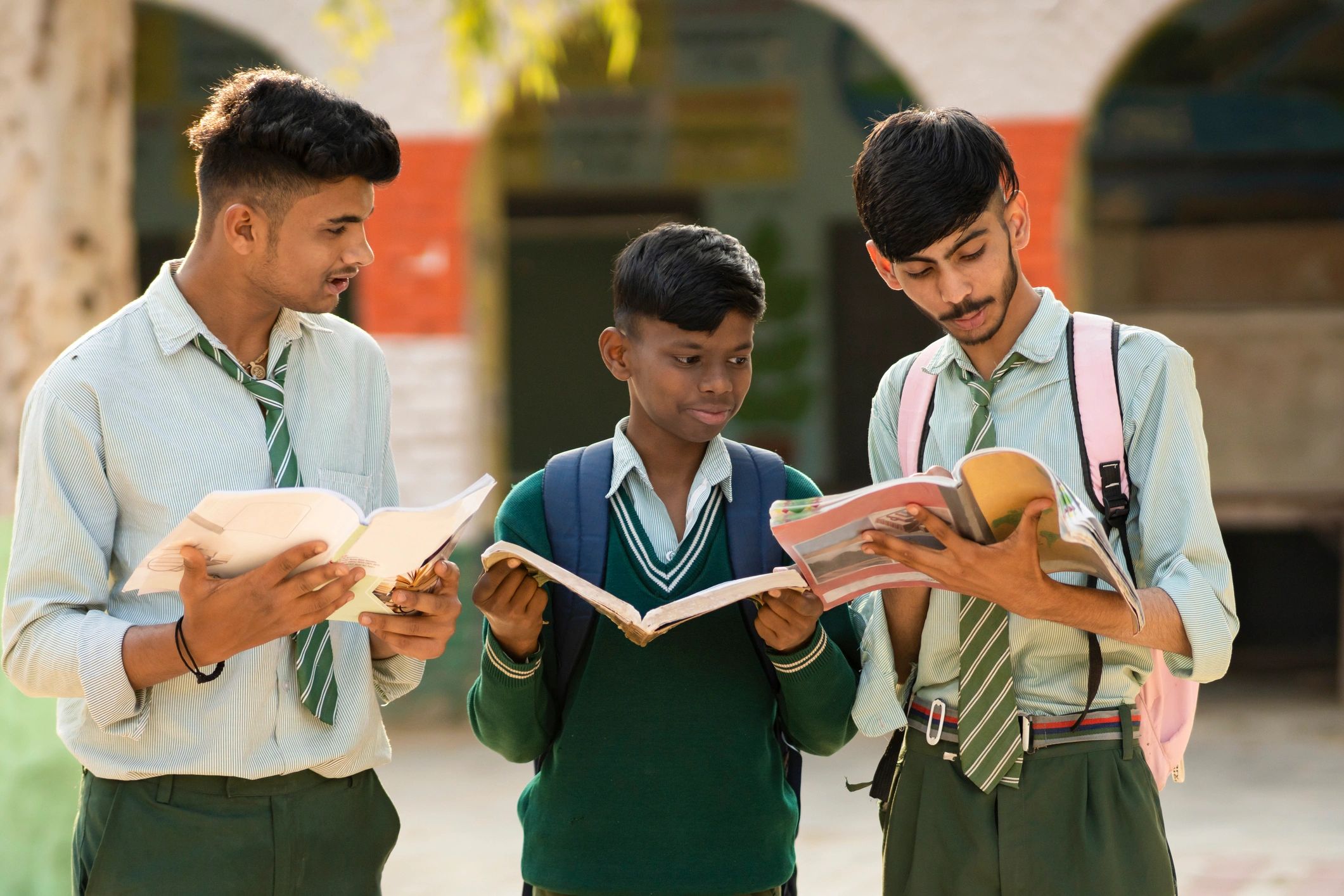Students studying together with books and educational materials